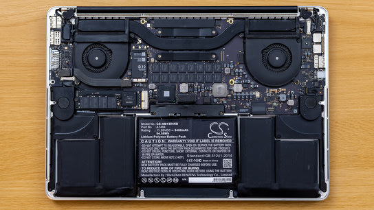 The insides of a MacBook computer seen after removing the back cover.