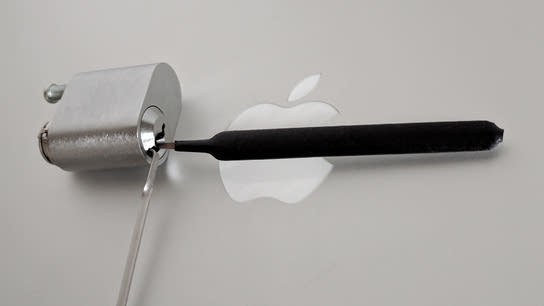 A lockpicking set opening a deadbolt lock in front of the Apple logo.
